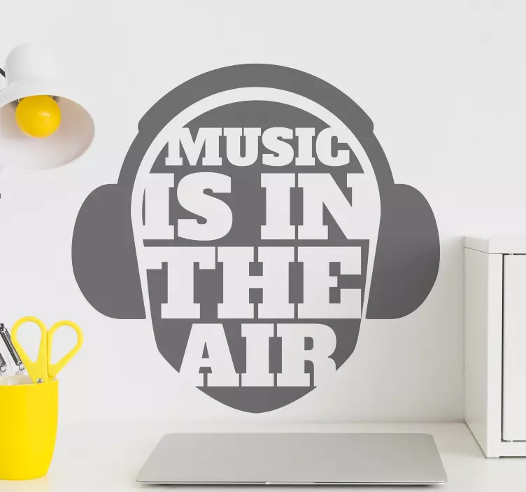 Music is in the air text with headphone dj sticker - TenStickers