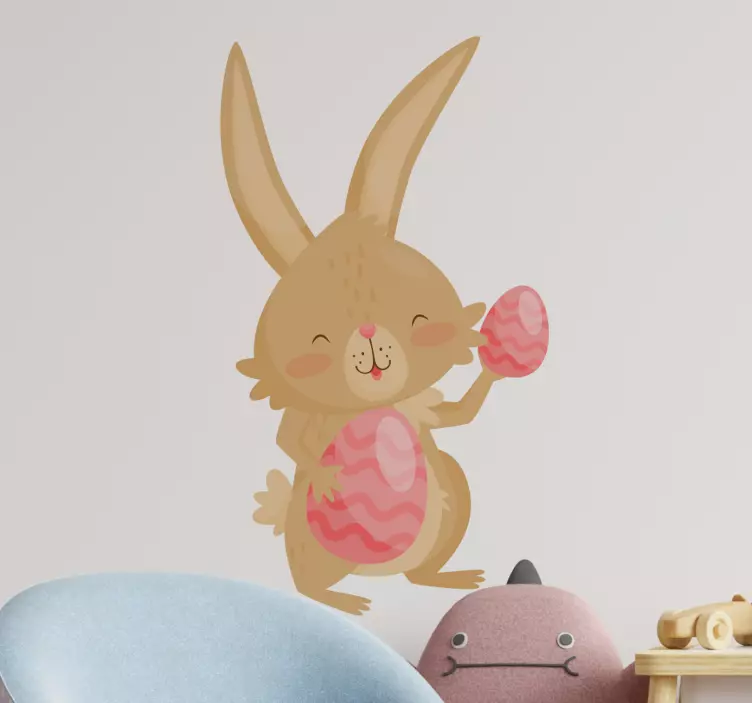 Easter bunny holding pink egg wall sticker - TenStickers